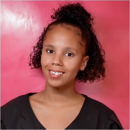 Young woman with curly hair, fresh look.